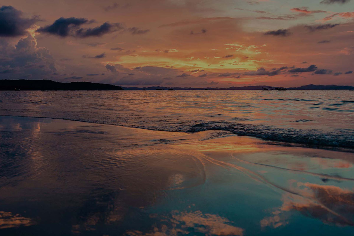 Washed out photo of waves on the beach at sunset